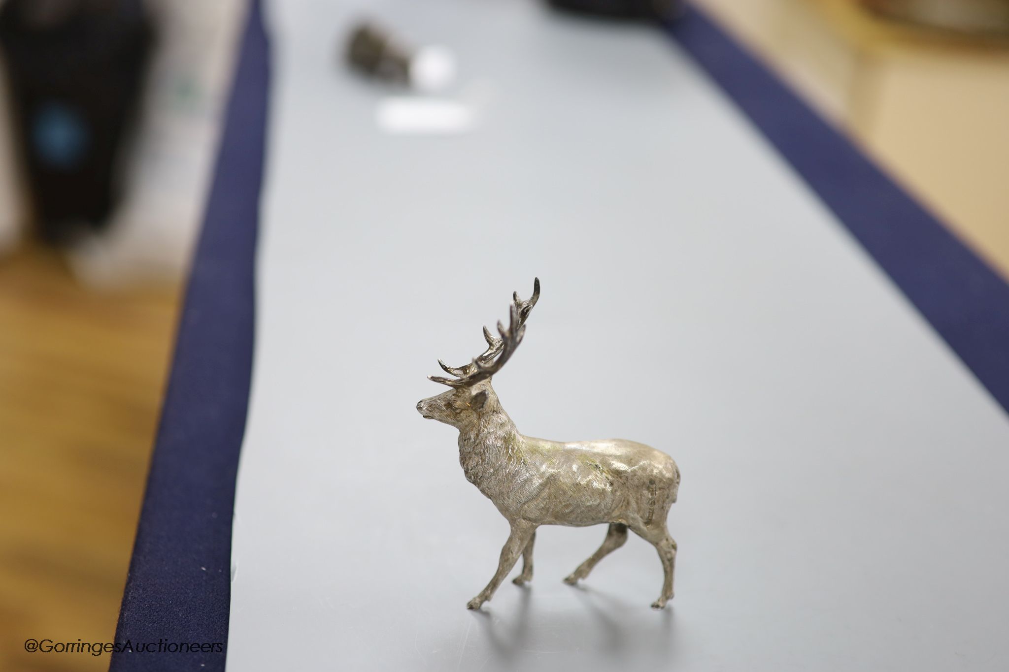 A modern free standing silver miniature model of a stag, C.F.H & Co, London, 1990, height 10.9cm, 162 grams.